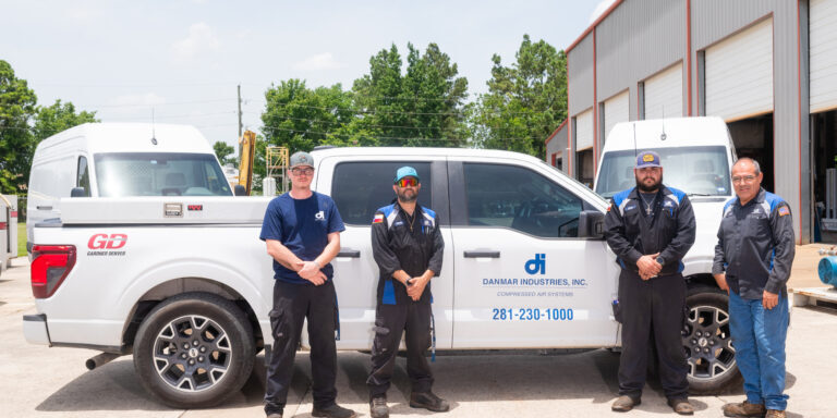 4 Danmar Industries crew members standing in front of their truck